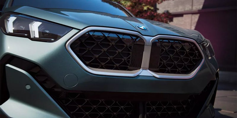 BMW luxury vehicle front grille and LED headlight close-up showcasing premium automotive design