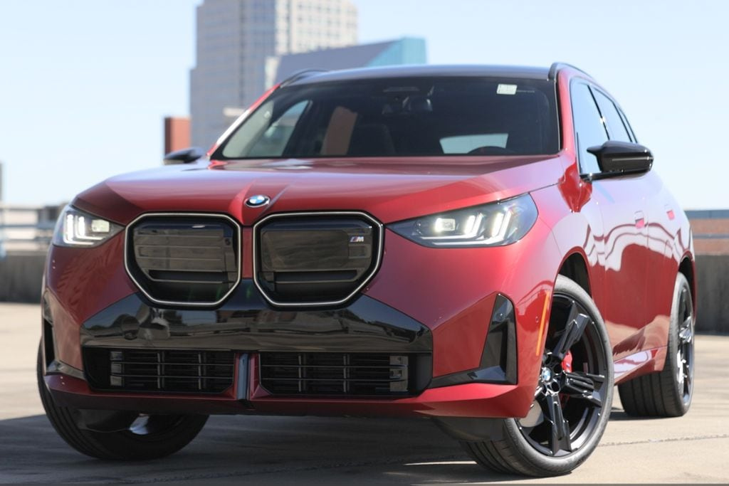Front view of a red BMW X3 luxury SUV with its kidney grille and LED headlights